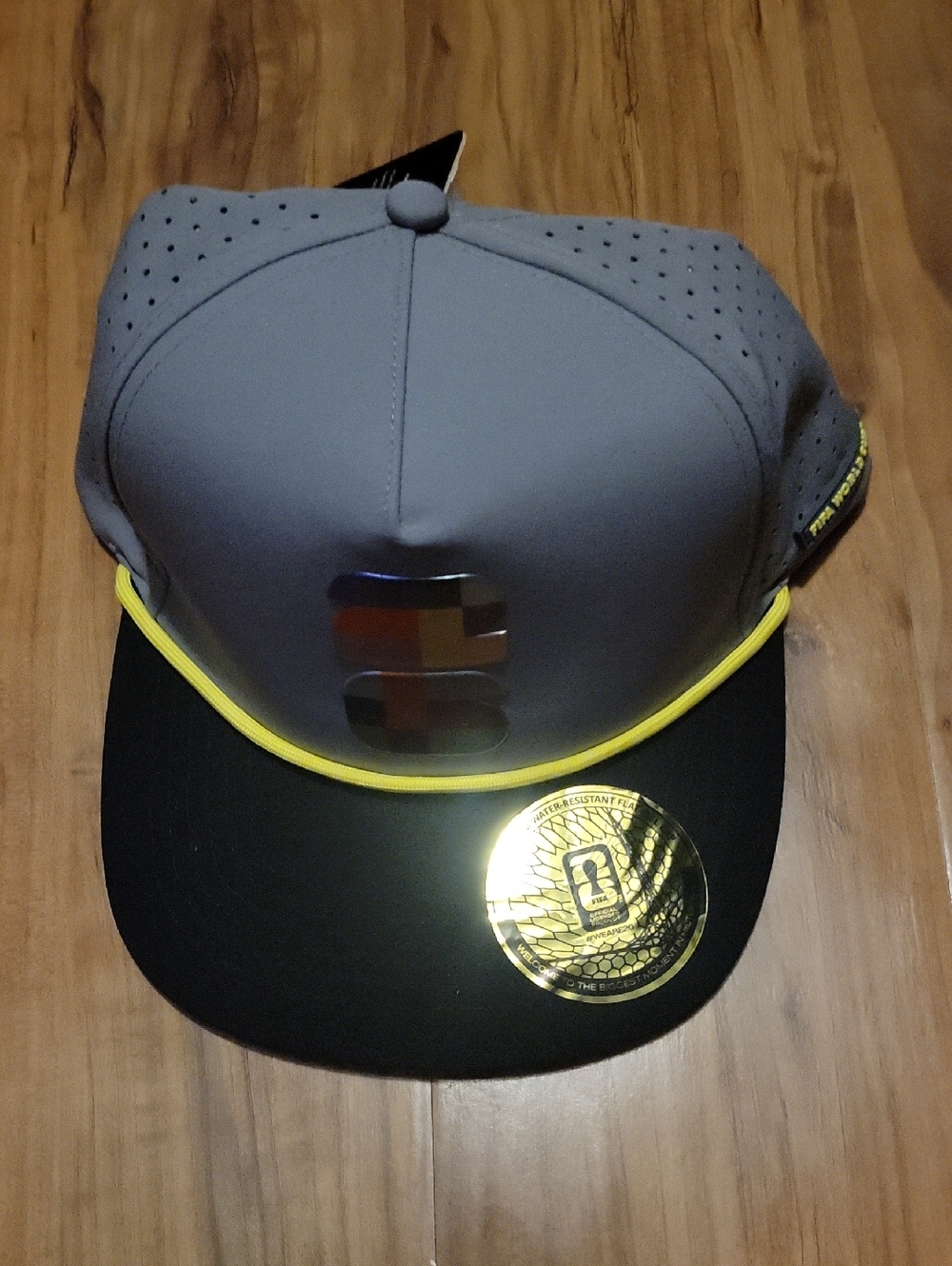 Fanatics Gray and Black Snapback Hat with Yellow Trim FIFA Limited